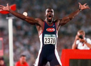 Michael Johnson celebrates after his world record 19.32 seconds in the 200.  Usain Bolt of Jamaica ran a 19.19 in August